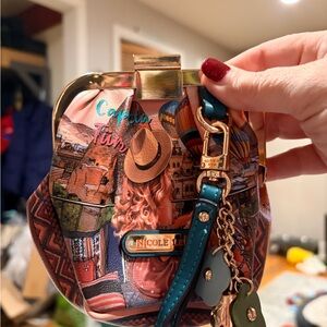 Nicole Lee “Heaven on Earth” wristlet.